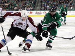 Matt Duchene of the Colorado Avalanche tries to cut around Johnny Oduya of the Dallas Stars at American Airlines Center on December 29, 2016 in Dallas. (Ronald Martinez/Getty Images)