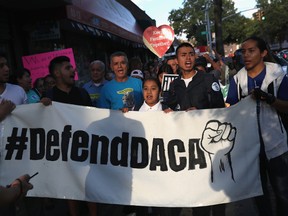 Immigrants' rights demonstrators march in protest of President Trump's decision on DACA on September 7, 2017 in the Queens borough of New York City.  (Getty Images)