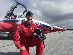 Elliot Ferguson/The Whig-Standard
Snowbirds pilot and Royal Military College graduate Capt. Maciej Hatta stands next to his aircraft at Kingston’s Norman Rogers Airport on Friday.
