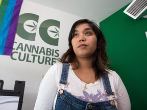 Ming Saad, who describes herself as a "volunteer bud tender" at Cannabis Culture on Bank St, contemplates the news that the province announced that a new arm of the LCBO will be responsible for selling recreational marijuana in Ontario and that all other establishments currently selling pot will be permanently shut down.  Photo Wayne Cuddington/Postmedia