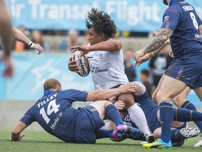 Wolfpack’s Fuifui Moimoi gets taken down by Whitehaven players during Super 8s rugby action. The Wolfpack plays host to the Barrow Raiders today. (Ernest Doroszuk/Toronto Sun)
