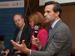 Karl Baldauf, right, vice-president of policy and government relations at the Ontario Chamber of Commerce, makes a point during a panel discussion on the Ontario government's proposed workplace reforms at a Greater Sudbury Chamber of Commerce luncheon in Sudbury, Ont. on Friday September 8, 2017. John Lappa/Sudbury Star/Postmedia Network