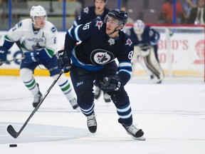 Winnipeg Jets' Mathieu Sevigny skates with the puck against the Vancouver Canucks at the Young Stars Classic held at the South Okanagan Events Centre in Penticton, B.C., on Friday, Sept. 8, 2017. (Richard Lam/Postmedia Network)