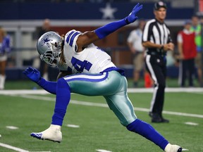 Cowboys linebacker Jaylon Smith celebrates tackling Raiders running back DeAndre Washington after a short run during preseason NFL action in Arlington, Texas, on Aug. 26, 2017. (Ron Jenkins/AP Photo)