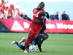 TFC's Jozy Altidore gets the ball past a San Jose defender during Saturday's game at BMO Field. (THE CANADIAN PRESS)