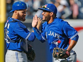 Blue Jays catcher Russell Martin (left) and second baseman Devon Travis (right) are worried about their homes and family in Florida as Hurricane Irma approaches this weekend. (Kathy Willens/AP Photo/Files)