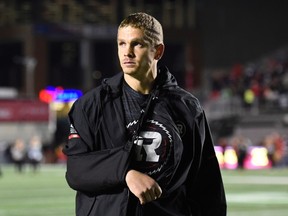 Redblacks quarterback Trevor Harris, who was injured in the third quarter, walks off the field following his team's loss to the Tiger-Cats in Ottawa on Saturday, Sept. 9, 2017. (Justin Tang/The Canadian Press)