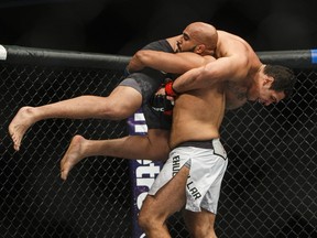 Luis Henrique of Brazil is lifted by Arjan Singh Bhullar of Canada during their mixed martial arts bout at UFC 215 in Edmonton, Alta., on Saturday September 9, 2017.