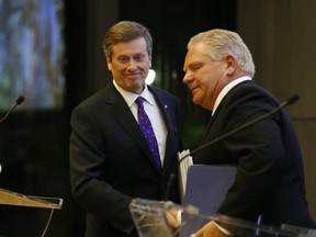 Mayor John Tory and challenger Doug Ford are pictured at a debate duing the last municipal election campaign. (Toronto Sun files)