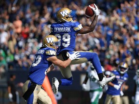 Winnipeg Blue Bombers WR Clarence Denmark celebrates his touchdown catch against the Saskatchewan Roughriders during the Banjo Bowl in Winnipeg with WR Julian Feoli-Gudino on Sat., Sept. 9, 2017. Kevin King/Winnipeg Sun/Postmedia Network