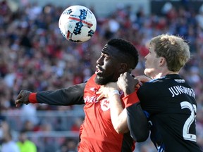 Toronto FC’s Jozy Altidore, heads the ball in front of San Jose Earthquakes’ Florian Jungwirth during Saturday night’s win. (THE CANADIAN PRESS)