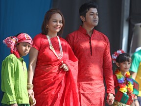 Members of the local Bangladeshi community take part in the fashion show portion of  the Multicultural Arts Festival in Confederation Park on Sunday. (Steph Crosier/The Whig-Standard)