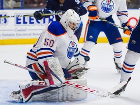 Edmonton Oilers goalie Stuart Skinner makes a save against the Winnipeg Jets during NHL preseason hockey action at the Young Stars Classic held at the South Okanagan Events Centre in Penticton, BC, September, 9, 2017.