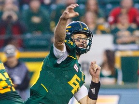 Edmonton Eskimos quarterback Mike Reilly (13) passes during first half CFL action against the Calgary Stampeders in Edmonton, Alta., on Saturday September 9, 2017.