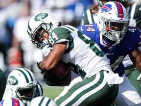 Kalif Raymond #84 of the New York Jets is tackled by Deon Lacey #44 of the Buffalo Bills during the second half on September 10, 2017 at New Era Field in Orchard Park, New York. (Photo by Brett Carlsen/Getty Images)