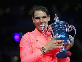 Rafael Nadal of Spain poses with the championship trophy during the trophy ceremony after defeating Kevin Anderson of South Africa during their Men's Singles finals match on Day Fourteen during the 2017 U.S. Open at the USTA Billie Jean King National Tennis Center on September 10, 2017 in the Queens borough of New York City. (Photo by Chris Trotman/Getty Images for USTA)