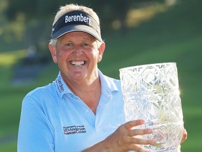 Colin Montgomerie of Scotland poses with the trophy after winning the Japan Airlines Championship, the first PGA Tour Champions event in Japan, on Narita Golf Club's greens in Chiba, near Tokyo, Sunday, Sept. 10, 2017. (Kyodo News via AP)