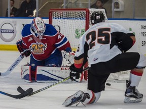 Travis Child of the Edmonton Oil Kings, blocks a shot from Cael Zimmerman of the Calgary Hitmen at the Community Rink in Rogers Place in Edmonton on September 10, 2017.