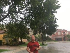 Attila Hertelendy, who was born and raised in Edmonton before becoming a professor in business at Florida International University and an adjunct research professor at Georgetown University teaching emergency management, stands outside his home in West Palm Beach, Florida, on Sunday, Sept. 10, 2017, as Hurricane Irma sweeps across Florida. SUPPLIED