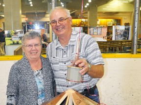 Winston and Sheila Jibb pose with the scale model Winston built of the Crystal Palace they had on display during the 163rd Mitchell & District Agricultural Society’s fall fair Sept. 1-3. The Crystal Palace was marking its 100th birthday and the Jibbs, who were longtime caretakers of the building even when they lived just outside of Mitchell on their farm, thought it be a great idea for the public to sign the model and have it on display in the future. Ironically enough, the Crystal Palace marked exactly 100 years of being opened Sept. 1, having been officially opened on Sept. 1, 1917 after it burned to the ground one year earlier. ANDY BADER/MITCHELL ADVOCATE