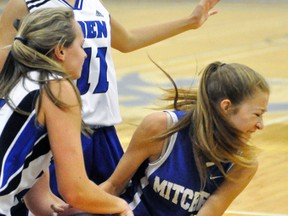 Bree Belfour (right) of the Mitchell District High School (MDHS) senior girls basketball team fights for possession of the ball during action against Eden of St. Catharines last Saturday, Sept. 9, part of the 2nd annual MDHS senior girls tournament at MDHS. The Blue Devils went 1-2 in the early bird tournament, finishing fourth. ANDY BADER/MITCHELL ADVOCATE