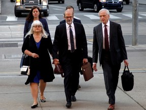 David Livingston (centre), chief of staff to former Ontario premier Dalton McGuinty, arrives at court in Toronto with his lawyer Brian Gover (right) on Monday, Sept. 11, 2017. Livingston and his deputy Laura Miller face allegations they illegally destroyed documents related to a government decision to scrap two gas plants ahead of the 2011 provincial election. (THE CANADIAN PRESS)