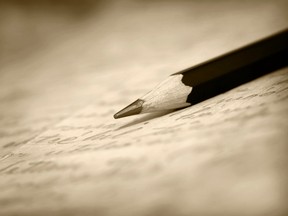 In this stock photo, a pencil sits on pages from a book of poetry. (Getty Images)