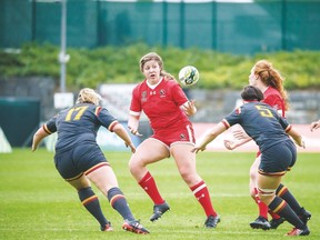 DaLeaka Menin played in the senior Women’s Rugby World Cup championships in Ireland this summer. Here, second from the left, she plays against Wales.