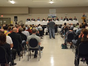 Concerned citizens line up to ask a panel of experts questions on Alberta’s impending Caribou Range Plan on Sept. 7 (Peter Shokeir | Whitecourt Star).