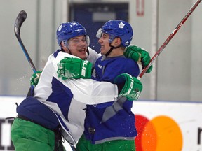 Toronto Maple Leafs rookies Auston Matthews and Mitch Marner hug during practice at the MasterCard Centre in Toronto on March 6, 2017. (Michael Peake/Toronto Sun/Postmedia Network)