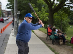 Against a background of pylons preventing any parking along Christie St., Jack Dominico, owner of the Toronto Maple Leafs baseball team, poses for a photo during a game at Christie Pits in Toronto on June 18, 2017. (Ernest Doroszuk/Toronto Sun/Postmedia Network)