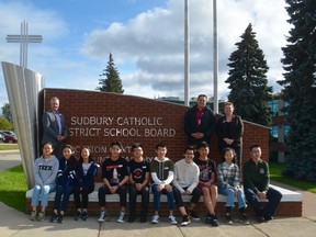 Superintendent Terry Papineau, back left, Michael Bellmore, board chair, and Joanne Benard, director of education, recently welcomed 11 international students for the 2017-2018 school year. The international students are from China and Vietnam, and will be completing their studies at Sudbury catholic secondary schools this year. Supplied photo