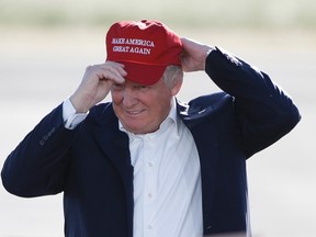 Then Republican presidential candidate Donald Trump wears his "Make America Great Again" hat at a rally in Sacramento, Calif. on June 1, 2016. (THE CANADIAN PRESS/ AP/Jae C. Hong)