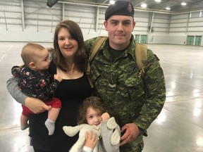 Cpl. Vince Lucas, a cook based in Edmonton, reunited with wife Jessie and daughters Brooke (seven months) and Rorie (four) at the Lecture Training Facility Building of CFB Edmonton Sept. 12, 2017. Lucas spent over four months in Ukraine, his first deployment overseas.