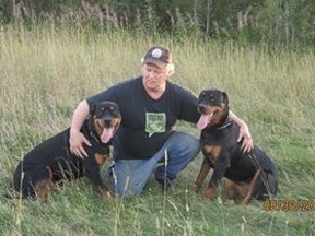 Denis Millette with the dogs he and his wife gave to each other for their 20th wedding anniversary.