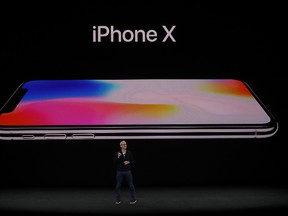 Apple CEO Tim Cook announces the new iPhone X during an Apple special event at the Steve Jobs Theatre on the Apple Park campus on September 12, 2017 in Cupertino, California. Apple is holding their first special event at the new Apple Park campus where they are expected to unveil a new iPhone. (Photo by Justin Sullivan/Getty Images)