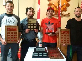 Imperials players Ryan Lounsbury, Donnie Portis, Matthew Goulais and Mitch Hannusch pose with their awards at the recent end-of-season banquet for the Sarnia football team. The Imps advanced to the semi-finals in this year's Northern Football Conference playoffs. (Handout)