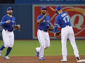 Teoscar Hernandez of the Toronto Blue Jays celebrates with Ryan Goins during MLB action against the Baltimore Orioles at Rogers Centre on Sept. 11, 2017. (Tom Szczerbowski/Getty Images)