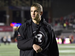 Ottawa Redblacks quarterback Trevor Harris, who was injured in the third quarter, walks off the field following his team's loss to the Hamilton Tiger-Cats in CFL action in Ottawa on Sept. 9, 2017. (THE CANADIAN PRESS/Justin Tang)