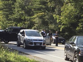 A suspect in an active shooter incident at Dartmouth-Hitchcock Medical Center was pulled from a grey Ford Escape at the intersection of LaHaye Drive and Mount Support Road in Lebanon, N.H., on Tuesday, Sept. 12, 2017. (Jennifer Hauck/The Valley News via AP)