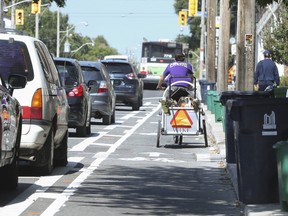 A cyclist heads north below Gerrard St. on Woodbine Ave. on Tuesday, Sept. 12, 2017. (JACK BOLAND/TORONTO SUN)