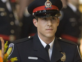 Constable Paolo Crescenzi signs the register during the Ottawa Police Service graduation ceremony for new officers in 2009. Chris Mikula/Postmedia CHRIS MIKULA / THE OTTAWA CITIZEN