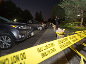 Ottawa police tape cordons off the scene of a police-involved shooting at 260 Brittany Dr. on Tuesday evening. Wayne Cuddington/Postmedia WAYNE CUDDINGTON / POSTMEDIA