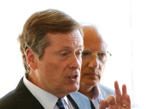 Toronto Mayor John Tory with then-Deputy Mayor Vince Crisanti at an announcement of increased Toronto transit off-peak routes on July 27, 2015. (Michael Peake/Toronto Sun)