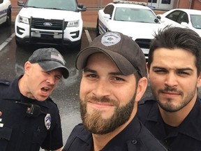 In this Sunday, Sept. 10, 2017, photo provided by the Gainesville Police Department, three members of the department take a selfie in Gainesville, Fla. The photo was widely-shared on social media after the department posted it to Facebook with comments praising the officers good looks. (Gainesville Police Department via AP)