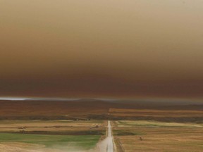 The smoke filled sky is shown looking south from St Henry's Church, south of Pincher Creek, AB on Tuesday, September 12, 2017. Firefighters continue to battle the fire from the ground and air with a large area under mandatory evacuation. Photo by Jim Wells/Postmedia