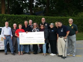 Pictured (from left to right): Maarten Bokhout, Jack Armstrong, Kathy Hunking (Clinton Optimist President), Simon VanDriel, Steve Small (President, Lake Huron Steel Horse Riders), Brenda Brown (founder & past president, Lake Huron Steel Horse Riders), Kathleen Barnard (Executive Director of Childcan), Steve Martin (Provincial Chaplain, ABATE Ontario), Kathy Krysak, Jackie Kinder (Optimist member & Childcan volunteer), Dennis Kysak, Rick Shropshall (President, Clinton R. C. Legion, Br. 140).