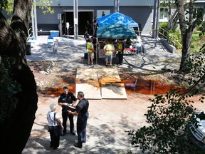 Police officers talk to an employee at the Rehabilitation Center at Hollywood Hills in Hollywood, Fla., Wednesday, Sept. 13, 2017.  (AP Photo/Marta Lavandier)