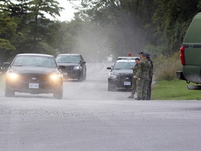 Ontario Provincial Police and Military Police leave from the CFB Kingston Yacht Club after recovering the body of a man in the St. Lawrence River between Cedar and Milton islands in Kingston, Ont. on Wednesday September 13, 2017. Steph Crosier/Kingston Whig-Standard/Postmedia Network