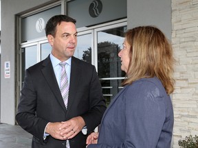 Tim Hudak, CEO of the Ontario Real Estate Association and former Ontario PC Party leader, with Colleen Emmerson, president of the Kingston Area Real Estate Association, at the Ramada Hotel and Conference Centre in Kingston on Wednesday. (Ian MacAlpine/The Whig-Standard)